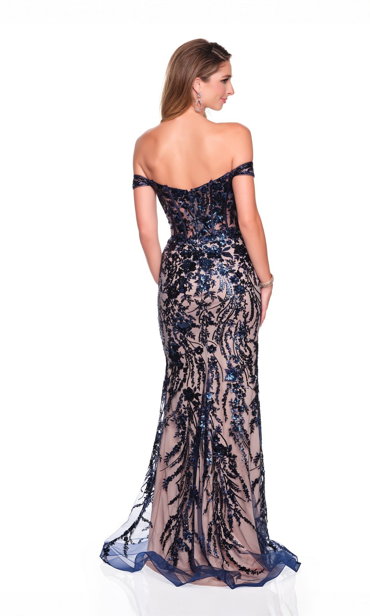 Woman in the Dave and Johnny 12854 long prom dress, featuring blue sequin floral patterns over nude mesh in an off-the-shoulder design, shown from the back on a white background. Elegant and glamorous formal style.